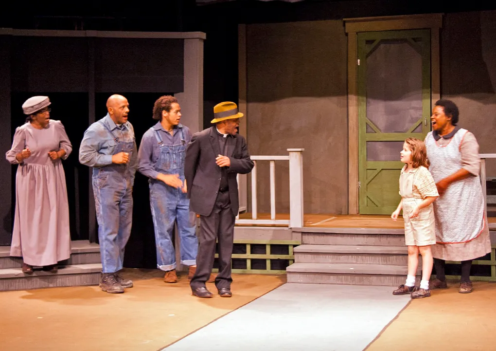 ToKillaMockingBird_2014 iconic scene where Scout and Calpurnia are outside a house looking at townsfolk in To Kill a Mockingbird by Pentacle Theatre 2014